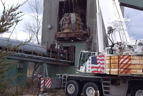 The crusher weighed 66 ton and was taken out of the building and set on the ground. It was then brought to another location to be used elsewhere.