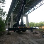 Extra wooden cribbing was needed under the feet of the outriggers to level the crane because it was set up on a hill
