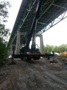 Extra wooden cribbing was needed under the feet of the outriggers to level the crane because it was set up on a hill
