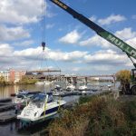 Taking boats out of the river for the winter.