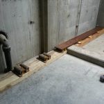 The channel will slide from where it is to the other set of steerman dollies taking it from out of the whole and into the building into a more manageable area to work and transfer the unit off of the channel and onto the dollies that it will be on for transporting it over to the pad.