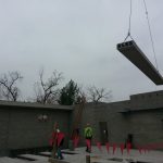 Setting the first piece of concrete plank.