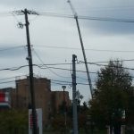 View from a few blocks away of crane with jib extended.