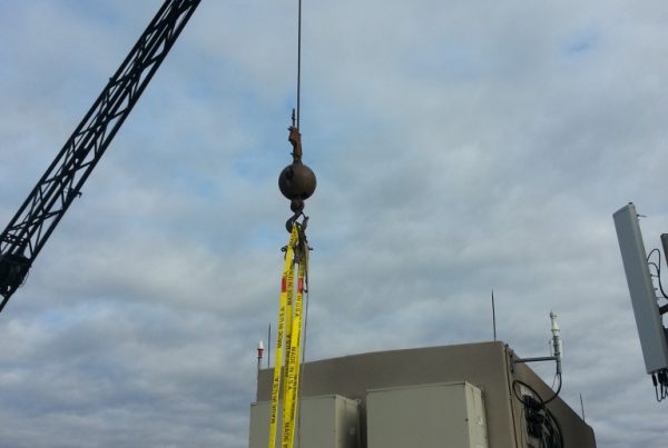 Shot from the roof. Getting ready to hook one of the small A/C units on the side of this cell building.
