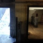 The door on the left leads to the staircase outside where the crane is. The door on the right we need to rig the old transformers out of the room and to the bottom of the stairs where we can then pick them with the crane and load them onto our truck.