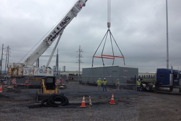 Setting 70,000 lb. building with our 2-18 ft. spreader bars good for 40 ton each.