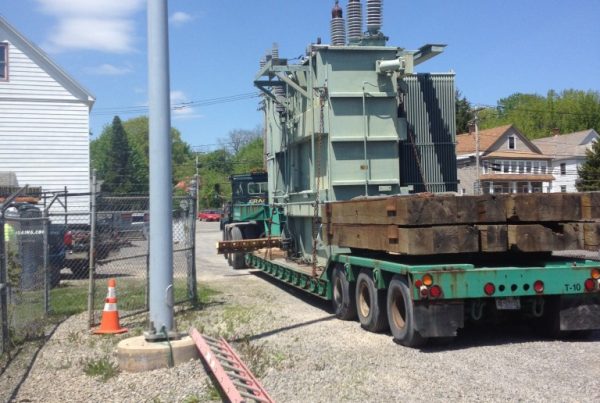Old generator that we lifted onto one of our trailers to be moved out of the way and unloaded to make room for the new transformer.