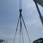 Picture of the rigging used. Kevlar straps, shackles, and wire rope chokers.