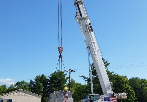 Loading a transformer that weighs 93,000 lbs. onto our trailer.