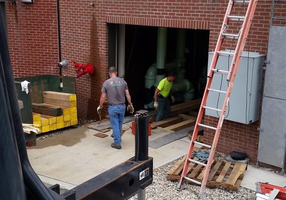 Setting a wood crib up to install chiller into basement floor