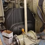 Old compressor rigged off chiller and ready to be rigged out of basement.
