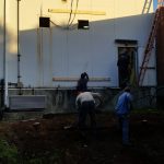 Removing the section of wall where the freezer and oven will be installed.
