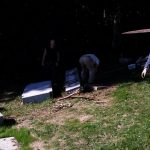 A gravestone was knocked over when I a giant tree fell on it and knocked it over.