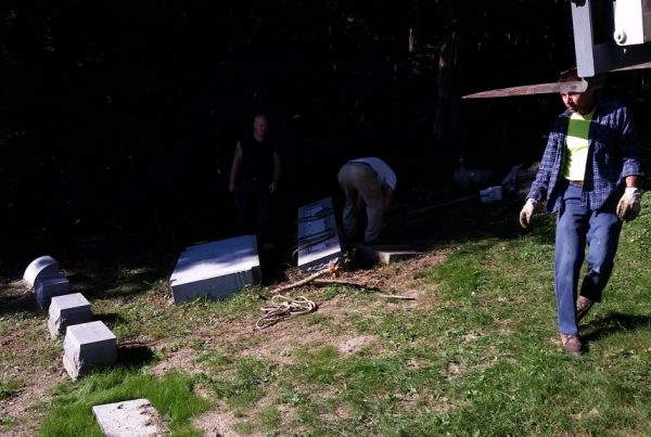 A gravestone was knocked over when I a giant tree fell on it and knocked it over.