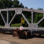 First truss. Each section weighed 96,000 lbs. and was 164 ft. long 15 ft. high and 2 ft. wide.