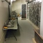 The old and new compressor needs to go down this hallway to exit the basement.