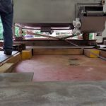 Using a grip hoist to help bring the piece into the building.
