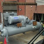 Starting chiller into the opening using a spreader bar.