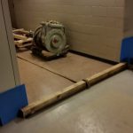 We use a hard wood 4x4 timber with a metal bar to use as a tie back from pulling compressor into the hallway.