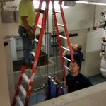 A view from the basement where the old compressor needs to come out and the new one brought in.
