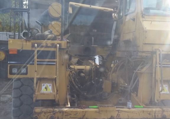 Lifting a 6,000 lb. engine into a 988 loader.