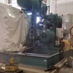 Using our hydraulic jacking system to lower the chiller down to the pad.