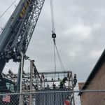 Removing old transformer from electric yard.