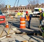Setting in the middle of a busy street in Schenectady, NY setting a concrete vault.