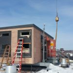 You can see the holes in the side of the building where the A/C units were removed and replaced with new ones. This is a verizon wireless building that helps create the communication between your phone to make it work.