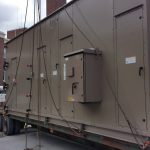 We used to spreader bars to keep from pinching and crushing the wide air conditioner. The electrical boxes on the side created a unique situation and trying to avoid getting into those was taken into consideration. Using our rolling wheels and lengthing here and there we were able to get the unit to balance level and avoid all contact points.