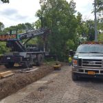 Our 22 ton crane setting precast footings for a flood wall near the Mohawk River.