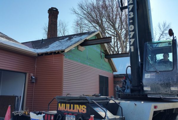 Another unique job done by Mullins Rigging. The home owner wanted a second story to their home. The builder wanted to keep the roof intact. So what do you do. Call us up and have us pick the roof off of the building. We lift the roof off by sliding two large beams through the builiding and picking from these points. Once the roof was off the builder builds the second floor and then we return to set the roof back on top. We make the impossible possible at Mullins Rigging.