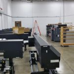 Installing the small printers at the new factory.
