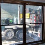 Looking out at the crane from inside the building.