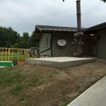 The existing old crematorium is close to the building. The large concrete empty pad is where we will install the new one.
