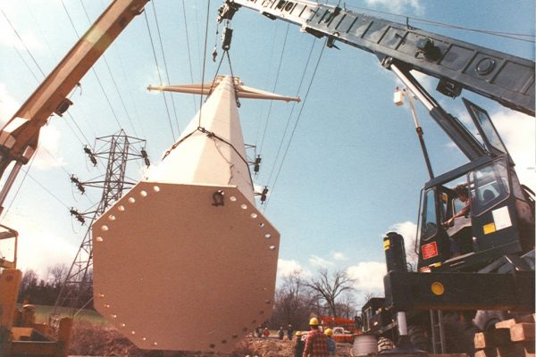 Mullins Rigging raising of power pole between energized electrical lines