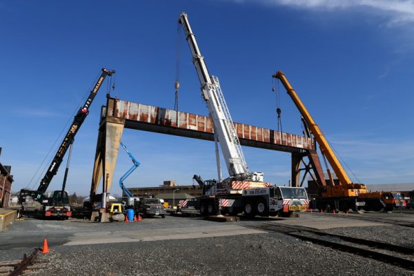 Mullins Rigging disassembly of overhead crane from the Watervliet Arsenal using four cranes.