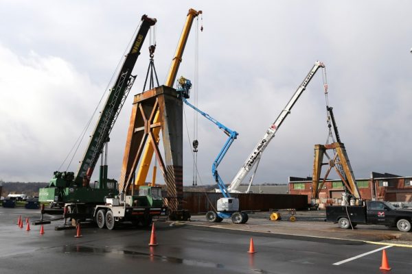 Mullins Rigging disassembly of overhead crane from the Watervliet Arsenal using four cranes.